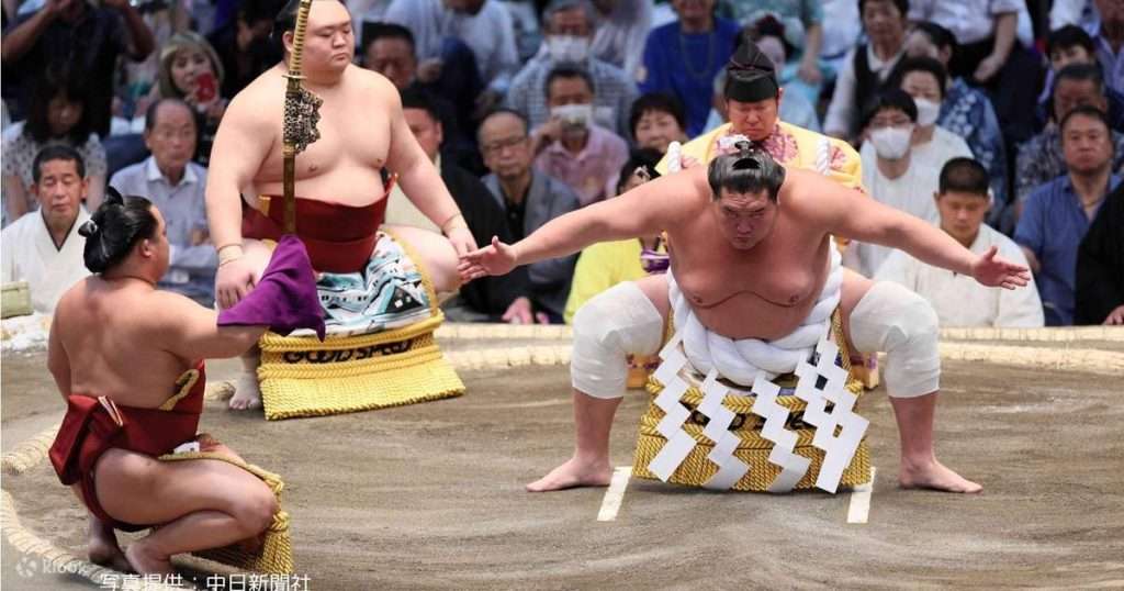 sumo wrestlers preparing for a match